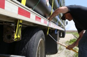 flatbed shipping cargo securement over-dimensional load straps
